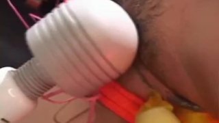 Asian cutie gets her pussy and ass pleasured with toys