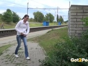 Preview 1 of Public Peeing - Brunette babe relieves herself in front of a packed train