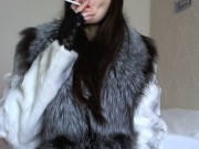 Preview 1 of Smokes sexually naked in stockings and in a fur coat