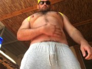 Preview 1 of Beefy Hairy Jock Flexing and Greasing Cock Outdoors