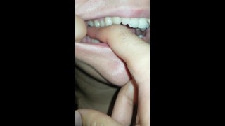 girl biting hard finger