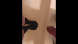 Couple pissing together on socks