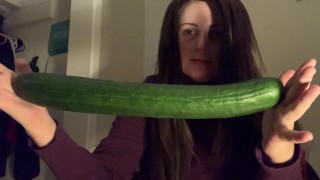 Sexy redhead stretching tight pussy with cucumber until squirting