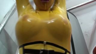 Getting fucked on slippery black rubber sheet in latex catsuit
