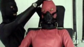 Chair Tied Latex Sub with Catheter Gagged and Smothered by Latex Mistress Femdom