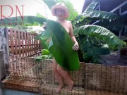 Preview 1 of Rural striptease. Country girl dancing in the yard of her house Rustic striptease with banana leaf