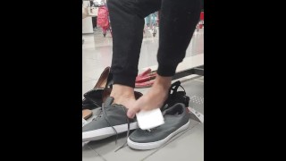 Trying on shoes at the mall