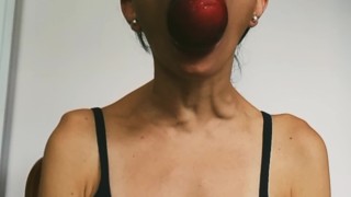 Eating a juicy peach and showing my neck veins