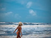 Preview 4 of Tik Tok. Beach Voyeur looks on Blonde Teen enjoying Topless in the waves.