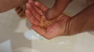Pissing on my palm and masturbating my dick in the bathroom.