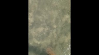 Feet under water at sea in sunny day