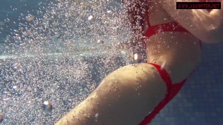 Brunette big tits babe Mia Ferrari swims in the pool