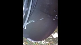 Guy cums on already cummed on Milf ass in black tights outside