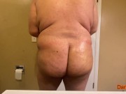 Preview 2 of Fat man oiling up his fat ass then shaking it