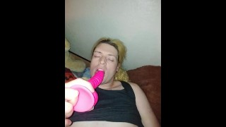 Horny femboy slut cums hard all over themselves while deepthroating a dildo