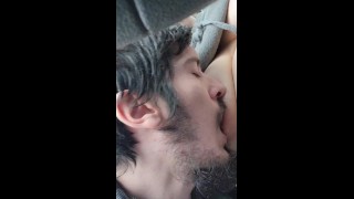 Playing and sucking wife's tits on car ride 