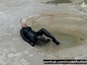 Preview 2 of Super Hot Blond Girl In Black Latex Catsuit + High Heels And Sunglasses Bathes In The Mud - Mud Bath