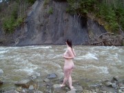Preview 1 of Naked girl walks near a mountain river