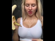 Preview 2 of Sexy blonde with huge breasts seduced and eats a banana