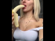 Preview 3 of Sexy blonde with huge breasts seduced and eats a banana