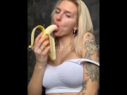 Preview 4 of Sexy blonde with huge breasts seduced and eats a banana