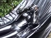 Preview 4 of Latex girl full in black rubber and Gasmask chill outs outdoor in garden in a heavy rubber hammock