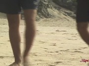 Preview 1 of Sensual Tanned Dark Haired Hunk Takes Two Dicks On The Sand!