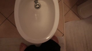 Boy with small dick pissing in the bidet