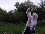 Preview 2 of Such tempting feet!  Cutie outdoors in a public place with a beautiful ass and legs