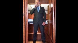 Daddy jerks uncut cock to porn while wearing suit then cums PREVIEW