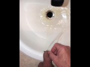 Preview 5 of Naughty Pissing and Cumming in my bathroom sink featuring a bullseye cumshot into the drain