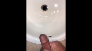 Naughty Pissing and Cumming in my bathroom sink featuring a bullseye cumshot into the drain