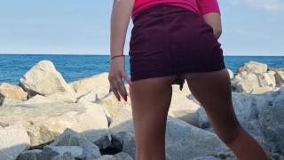 Horny girl gets naughty and squirts all over the beach