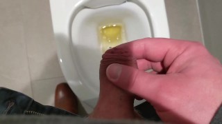 Uncut cock pisses at public toilet through big foreskin and dribbles on underwear