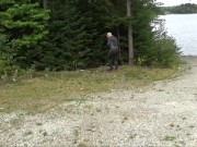 Preview 2 of wetsuited silicone masked man on patrol near lake