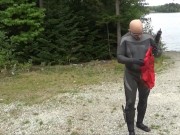 Preview 3 of wetsuited silicone masked man on patrol near lake