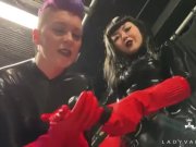 Preview 1 of Trailer - Latex Dommes Invite You To Suck Their Huge Strap Ons
