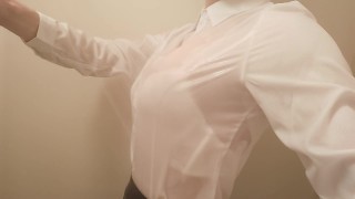 Crossdresser, light blue bra is seen through the camisole.