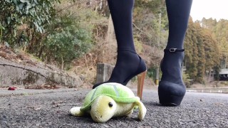 Masturbating and ejaculating while stomping on a stuffed animal in transvestite high heels Japanese