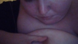 Girl licks and sucks her own nipple