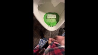 Pissing into a urinal in a pub. I play football with urine