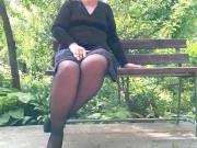 Preview 1 of Naughty milf in pantyhose pissing in the park on a bench rear view