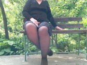 Preview 2 of Naughty milf in pantyhose pissing in the park on a bench rear view