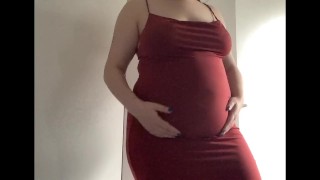 Round fat belly in a red dress