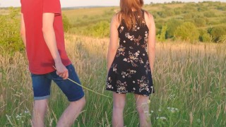 Spanking by cane of a girl in the field outdoor