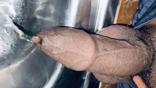 Uncut dick is pissing into the sink for 12th time