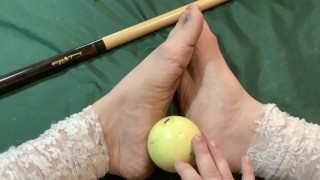 foot fetish. showing feet sitting on a billiard table