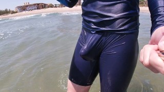 Surfer gets erect in his lycra for the pleasure of the people