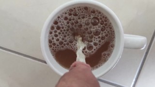 Piss into a cup with juice and making it overflow 