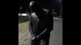doubled cocked masked wetsuited guy jerking off outside